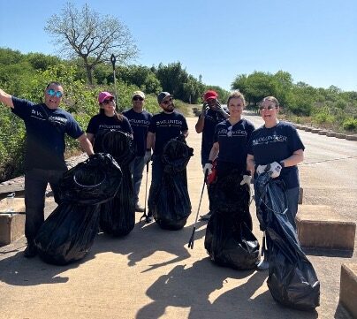 Volunteers gather with their trash collection