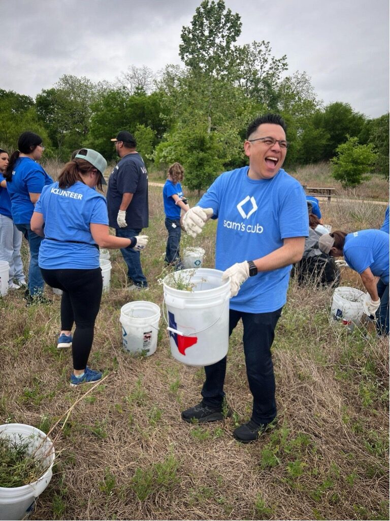 Employees of Sam's Club having fun during river cleanup