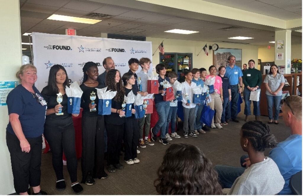 Students and teachers gather for a picture