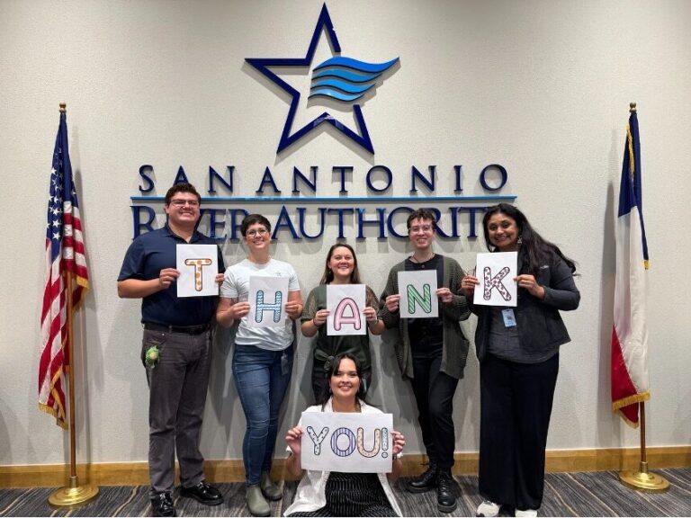 River Authority Staff hold thank you sign