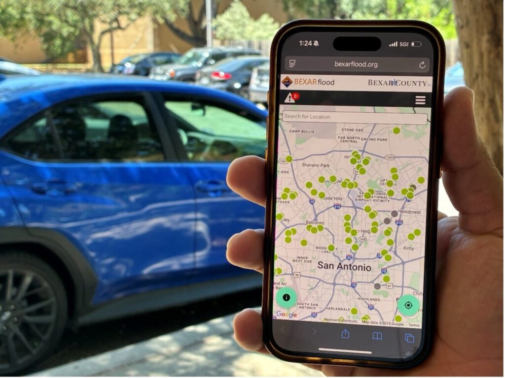 A phone displaying the BexarFlood.org.