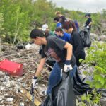 Volunteers remove trash during the clean up event.