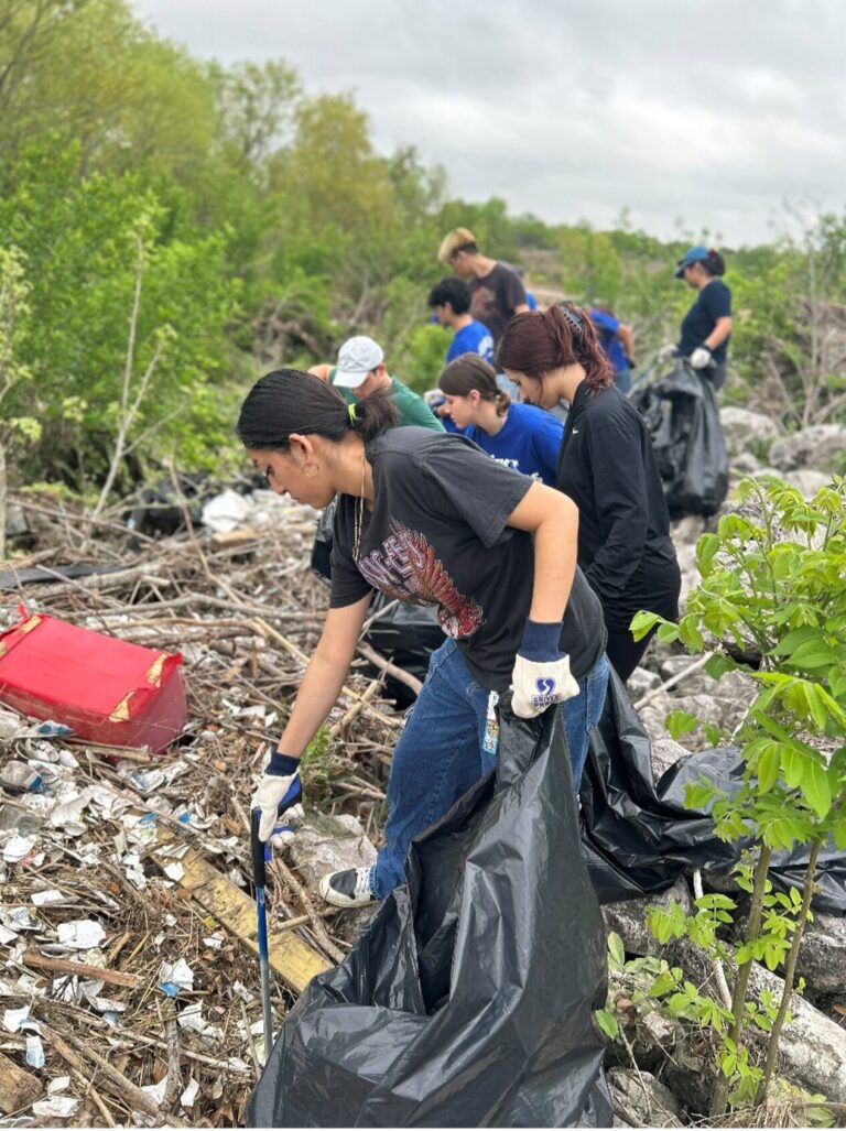 Volunteers remove trash during the clean up event.