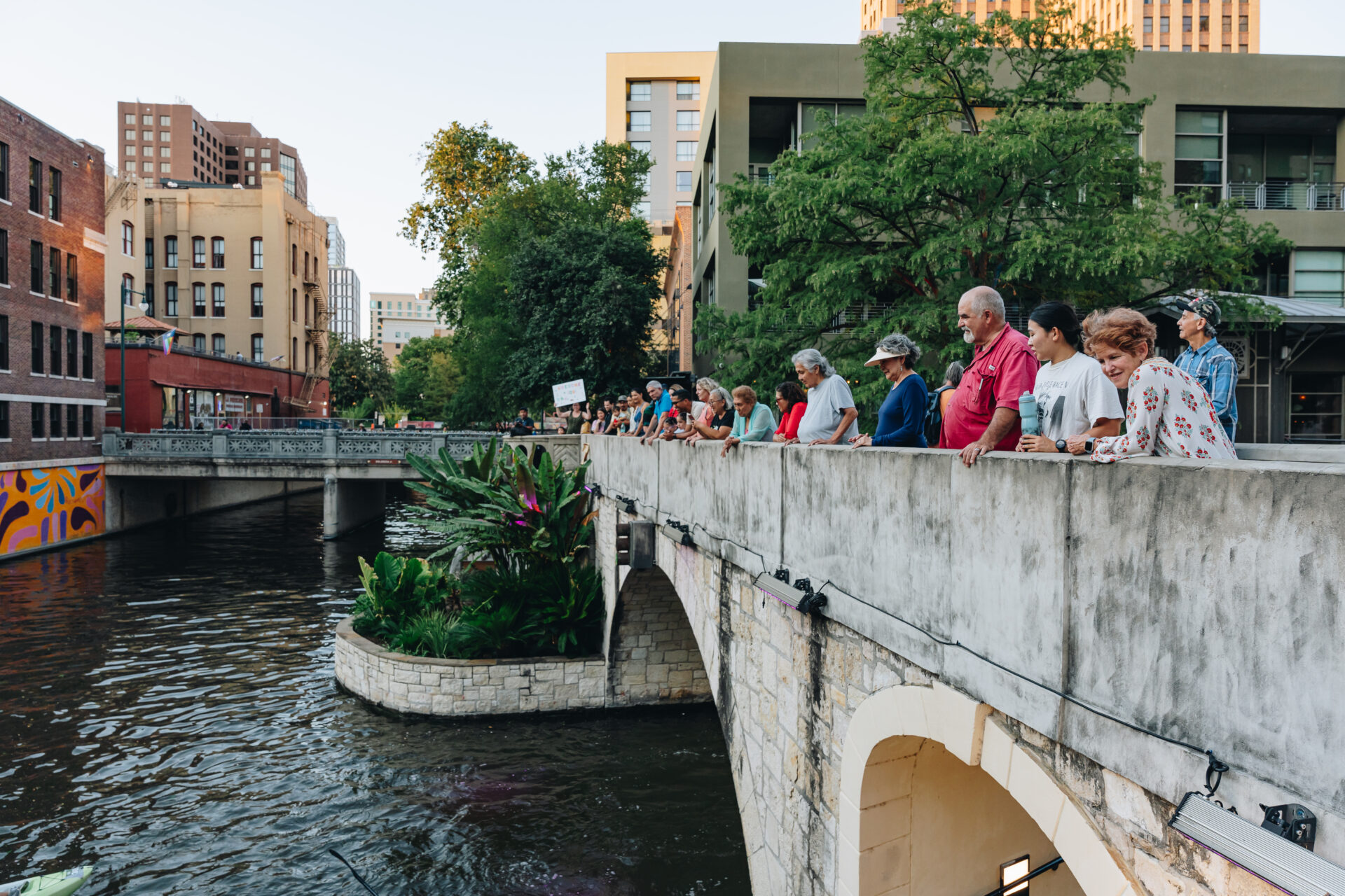 Spectators gathering to watch the Race the River Paddling Series in downtown San Antonio