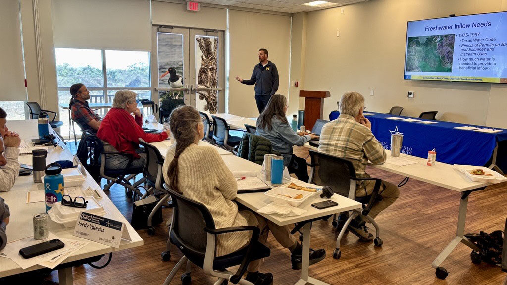 Shaun Donovan gives a presentation to the EAC members during a meeting