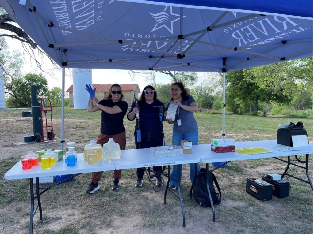 River Authority Staff under tent with a table