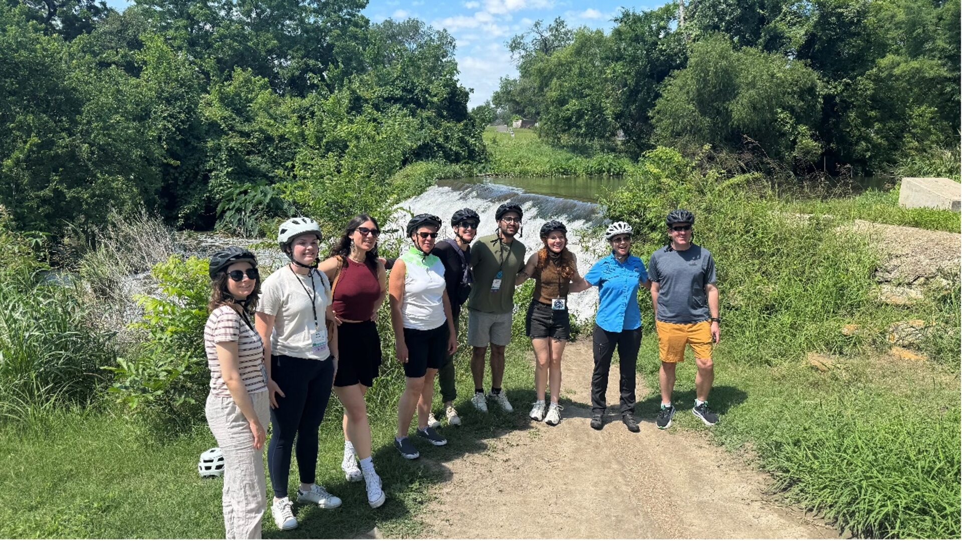 A Biking group poses together after bike ride along the Mission Reach