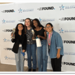 A group of young girls pose for a photo after winning the STEM Challenge competition