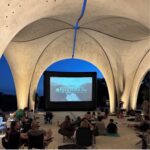 A large blow up screen underneath the pavilion at Confluence park