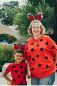 A woman and child dressed as ladybugs