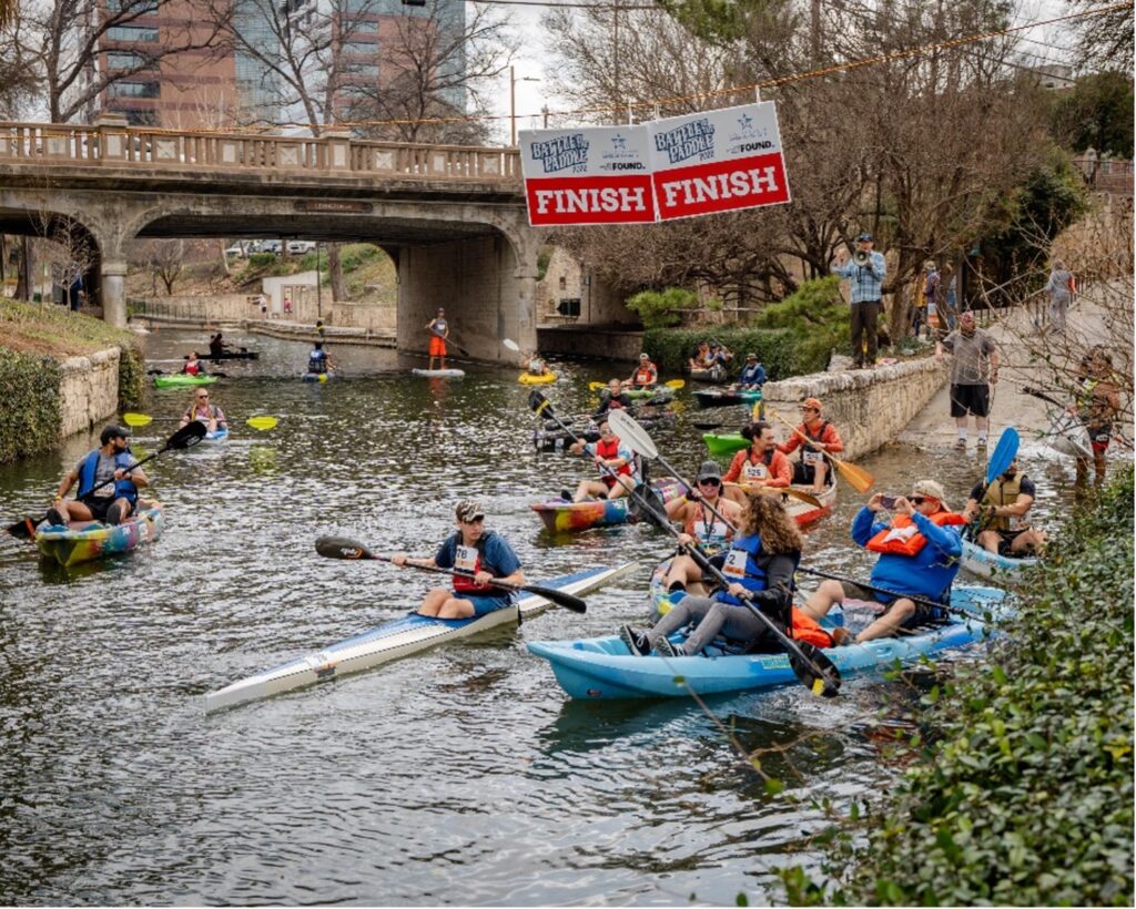 Race the River kayakers getting ready to race.