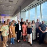 A group of River Warriors pose together at the reception.