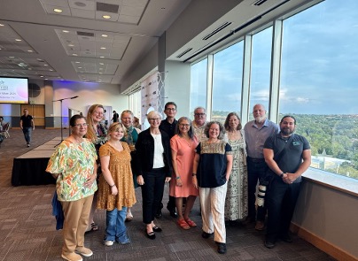 A group of River Warriors pose together at the reception.